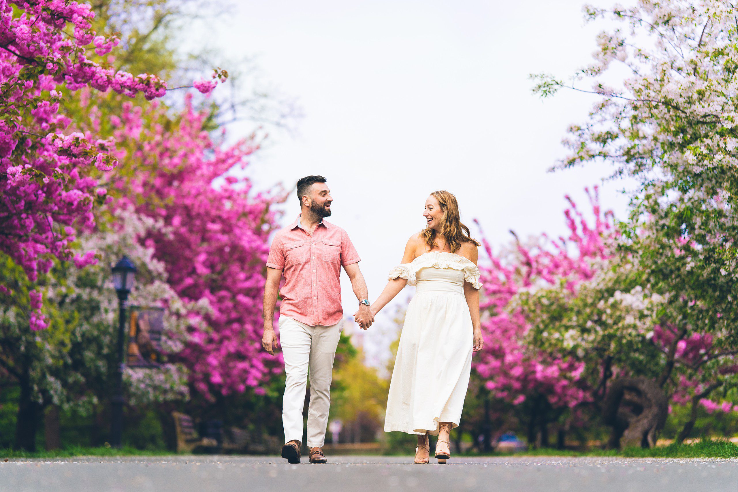 Cherry Blossom in NYC: Riverside Park Engagement Photos by Sascha Reinking Photography