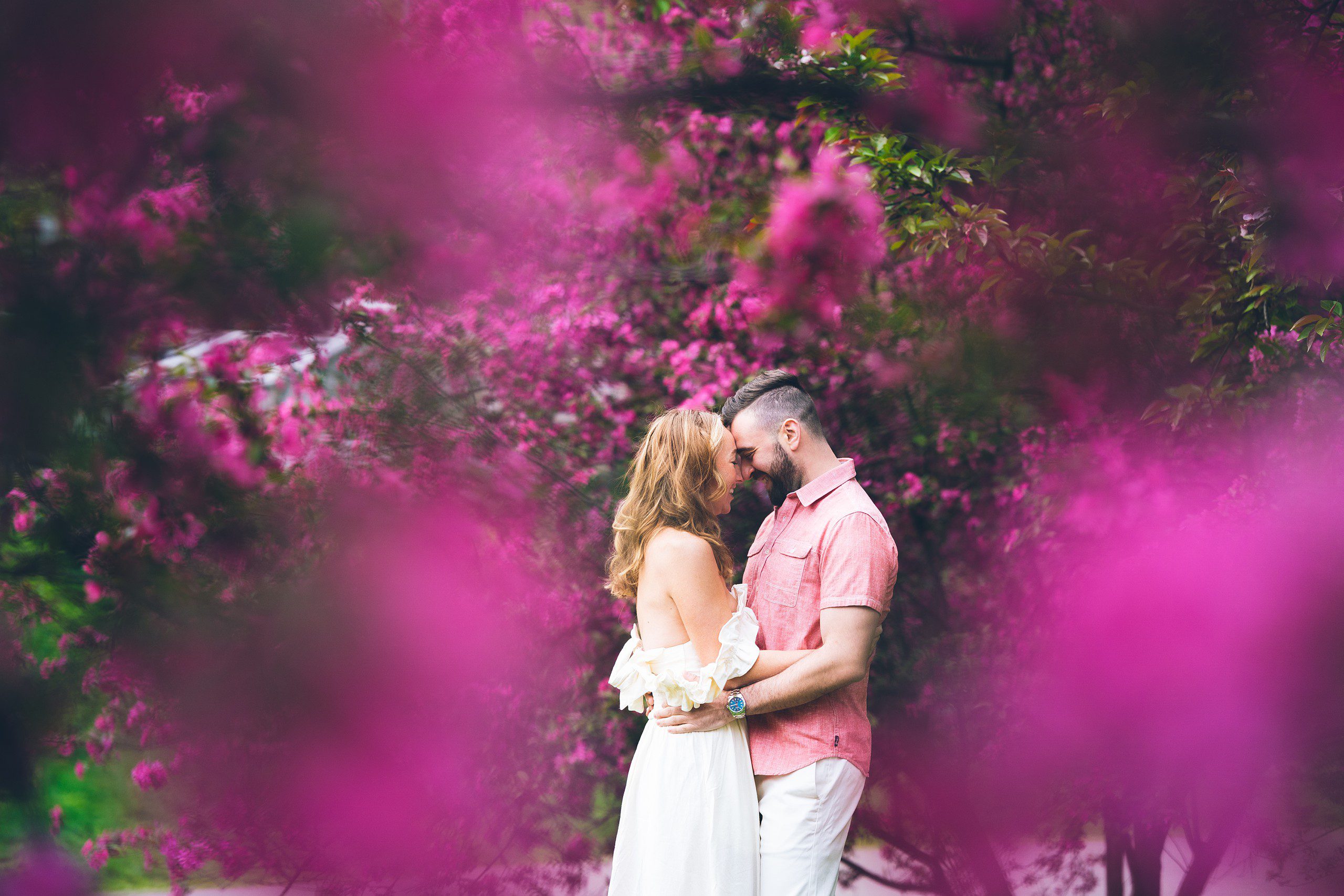 Cherry Blossom in NYC: Riverside Park Engagement Photos by Sascha Reinking Photography